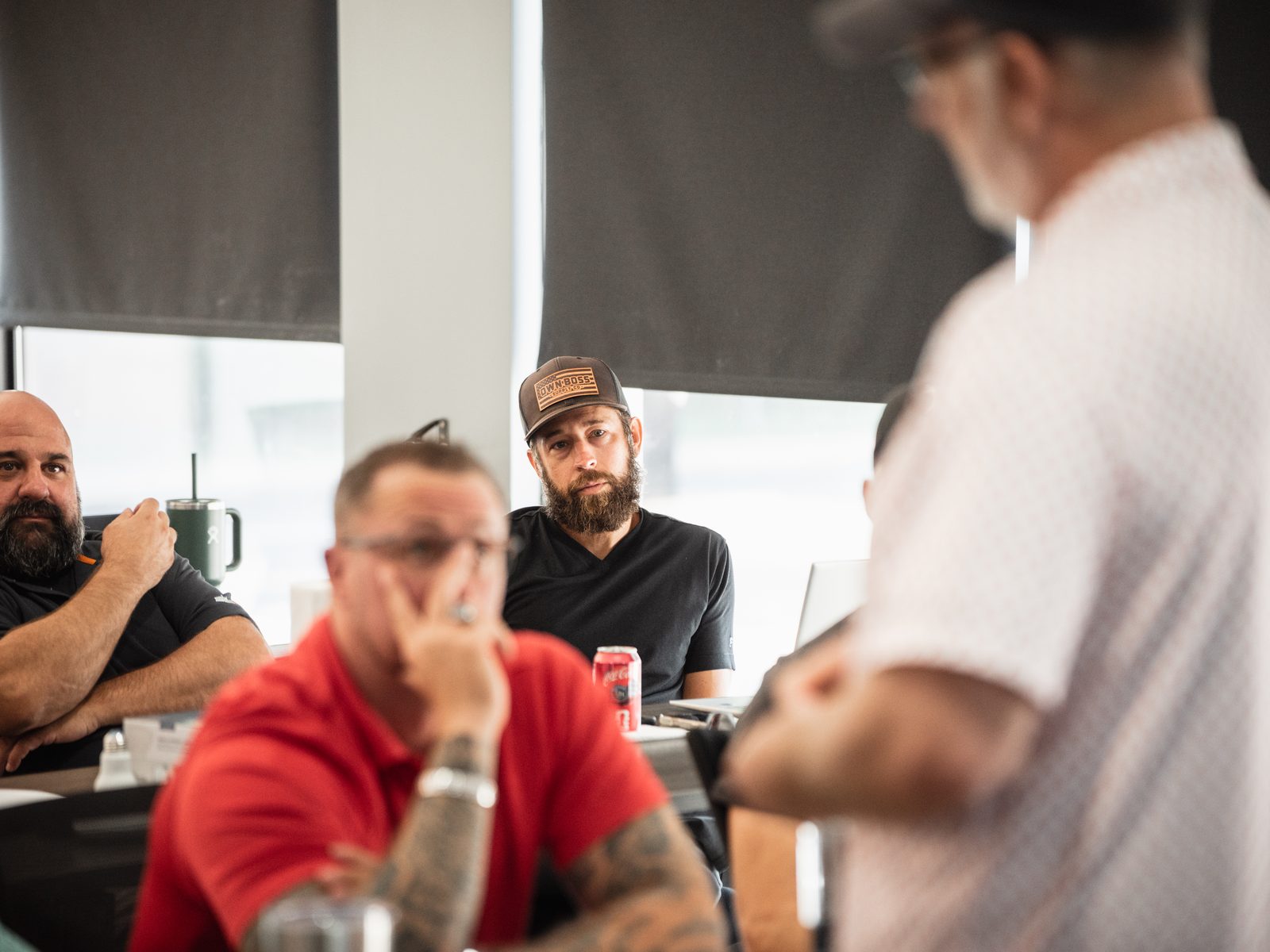 Members listening as a position is presented at a GEMS session