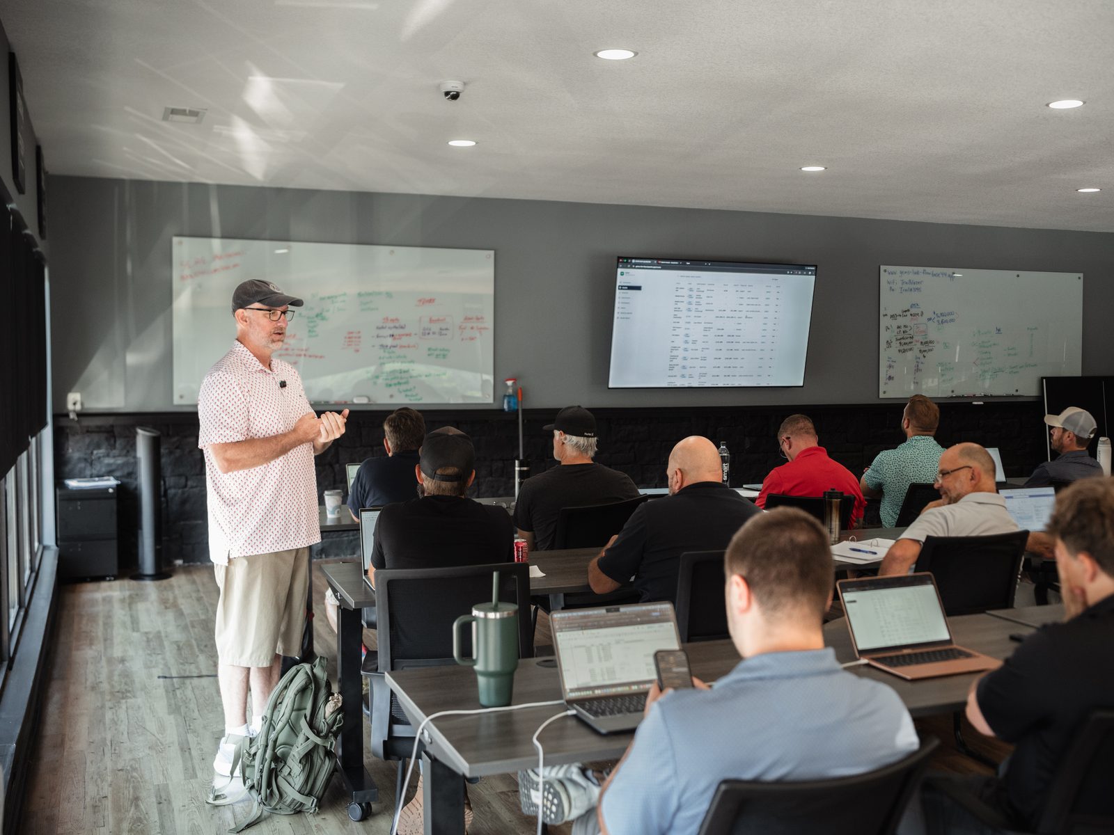 Jason Dillard working the board in front of the room at a GEMS session
